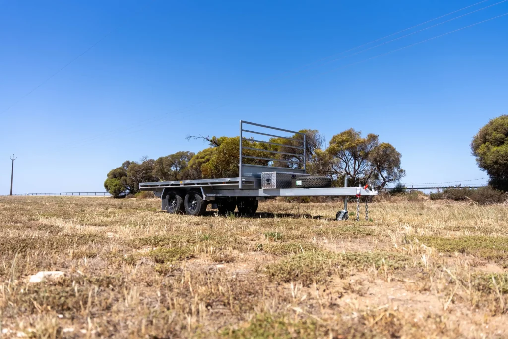 standard flat top trailer in the field - trailer warranty - rivercity trailers